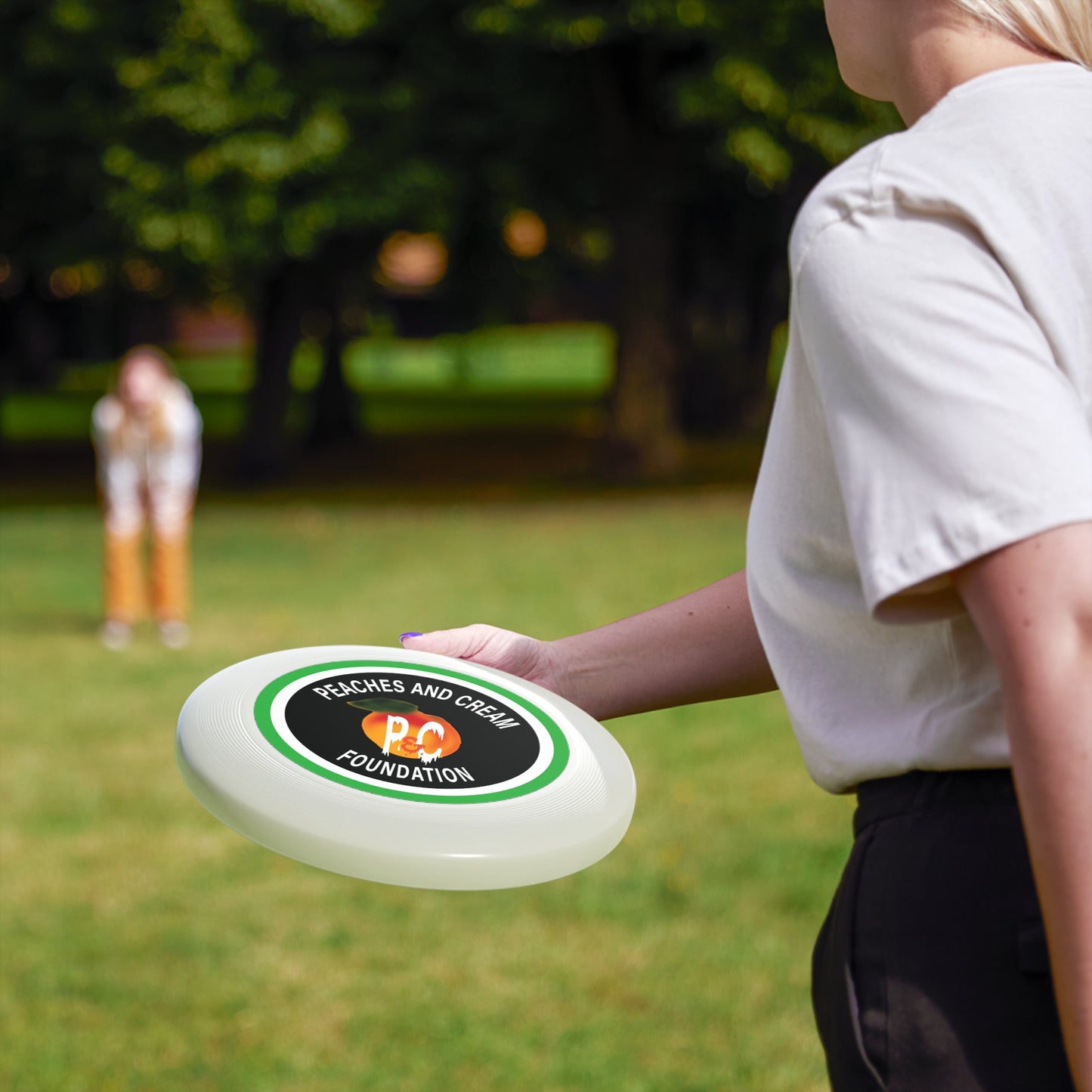 Green and White Outline Logo: Wham-O Frisbee