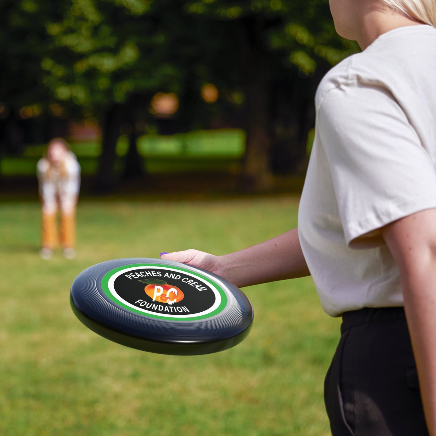 Green and White Outline Logo: Wham-O Frisbee